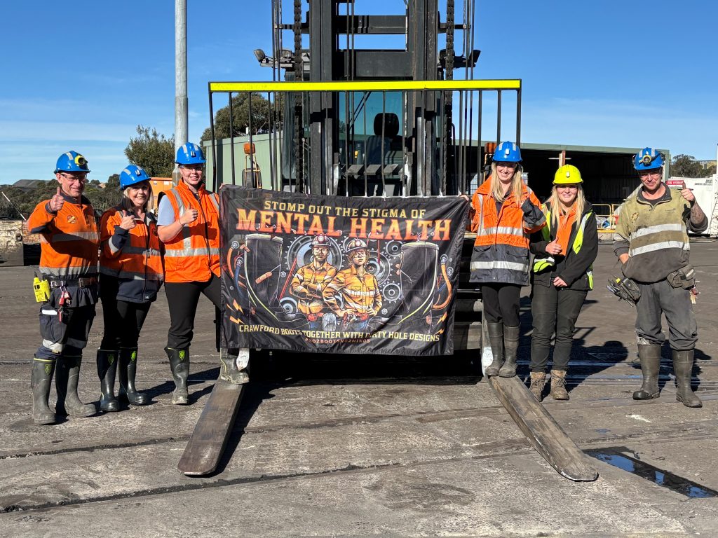 CLR forklift – taken at Clarence Collier, showcasing the 'Stomp out the Stigma' of Mental Health banner