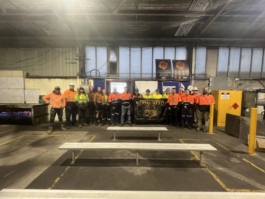 Centennials Northern Coal Services crew – taken at Northern Coal Services, showcasing the 'Stomp out the Stigma' of Mental Health Banner 